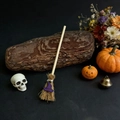 Mini witch broom with purple hat on black background with pumpkin and skull decor - Purple Hat
