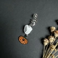 Detail of Halloween dreadlock jewelry with white crystal and orange pumpkin charm - White Turquoise With Pumpkin