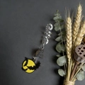 Detail of Halloween hair coil with silver spiral, crystal stone, and enamel bat charm - Tiger Eye With Bat