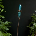 Macro detail of natural blue crystal wand wrapped in copper wire for floral decoration - Blue