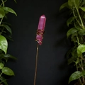 Detailed macro view of pink crystal prism wrapped in copper wire for floral decoration - Rose Red