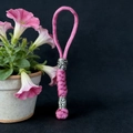 Detail of pink paracord braid with vintage silver viking beads and rune patterns - Pink