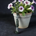 Detail of handcrafted green paracord lanyard with vintage silver viking mask beads - Camo Green