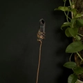 Macro detail of hand-wrapped copper wire on a natural purple crystal point ornament - Iridescent Black