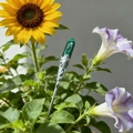 Close-up of vintage malachite floral hairpin set against bright sunflowers and leaves - Malachite