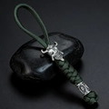 Detail of dark green paracord keychain with silver Spartan skull and rune beads - Army Green
