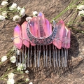 Detail of pink aura crystal moon hair comb with silver wire wrap on dark stone background - Peach Pink With Moon