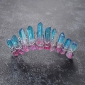 Macro shot of rainbow crystal bridal hair comb with silver wire wrap and prism stones - Pink Blue Silver Wire Silver Comb