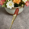 Red jasper hexagonal crystal pendant with ornate gold hollowed-out metal base - Red Jasper