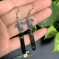 Detail of turtle earrings featuring silver metal tortoises and black crystal prisms - Black