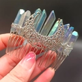 Detail of metal moon hair comb with iridescent crystals and intricate hollow wire pattern - Gray Moon
