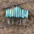 Detail of bohemian teal crystal hair comb with iridescent finish on a natural rock surface - Cyan Green Aura (22)