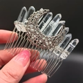 Detailed view of bohemian hair comb with raw clear crystal points and silver moon charm - Clear White Moon