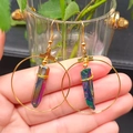 Detail of bohemian gold hoop earring featuring rainbow aura quartz crystal wrapped in wire - Multicolor and Gold Hoop