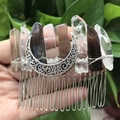 Detail view of handcrafted moon crystal hair comb with raw quartz stones and silver wire - Smoky Quartz And Clear Quartz