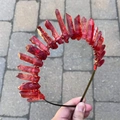 Macro detail of gothic raw red crystal quartz crown with manual wire-wrapped stones - Dark Red Crystal (Black Wire)