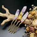 Detailed macro view of the purple crystal stones and crow skull on this bohemian hair pin - Light Purple + Gold Comb Gold Crow Head