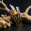 Handmade amethyst crystal hair pin with golden bird skull on rustic wood background - Dark Purple + Gold Comb Gold Crow Head