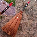 Macro shot of a handmade Wicca broom car charm with dark wood handle and red crystal prism - Plated Deep Red Crystal With Mixed Gemstone Beads