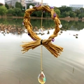 Natural amethyst wind chime with woven hay ring and iridescent crystal pendants - Amethyst