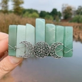 Detail of bohemian green crystal hair clip featuring silver triple moon goddess metalwork - Green Aventurine & Triple Moon