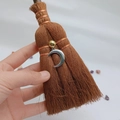 Detail of a handmade mini witch broom pendant featuring a silver crescent moon and crystal - Crescent Moon Style (04)