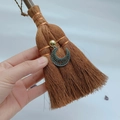 Macro view of mini wicca witch broom with silver moon charm and crystal accents - Bohemian Moon Style (09)