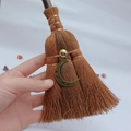 Detail of wicca mini broom with bronze moon pendant and natural fibers held in hand - Hollow Pattern Moon Style (13)
