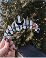 Detailed craftsmanship of black moon and iridescent crystal clusters on a handmade crown - Black/Aura White + Multicolor Crystal + Black Moon