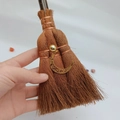 Macro shot of mini wicca witch broom with crescent moon charm and golden bead detail - Exquisite Moon Pendant Style (17)