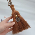 Detailed close-up of a mini handmade witch broom featuring a pentagram charm and crystal - Metal Pentagram Style (26)