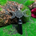Close-up of triple moon necklace with crystal pendant and intricate hollow pattern - Natural / Triple Moon Black Crystal Necklace