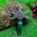 Detail of Triple Moon pendant with green crystal stone on a natural mossy wood background - Natural / Triple Moon Dark Green Crystal Necklace