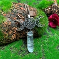 Macro shot of Triple Moon pendant with clear natural quartz crystal on a mossy background - Natural / Triple Moon White Crystal Necklace