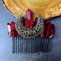 Detail of red crystal hair comb featuring a bronze moon and rose in gothic style - Deep Red Crystal With Antique Bronze Flower