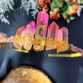 Detailed close-up of pink quartz crystals with gold moon and star accents on headpiece - Star And Moon Style
