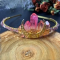 Detailed close-up of handmade pink crystal sun goddess crown with golden moon crest - Moon Style