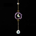Detail of amethyst crystal suncatcher with golden moon and sun metal ornaments - Amethyst