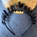 Macro detail of Gothic black crystal headband with silver crescent moon on wood base - Black Crystal + Black Moon + Black Headband