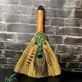 Detail of amethyst tree of life and peacock feather on handmade straw broom altar decor - Smoky Quartz Tree of Life with Top Crystal
