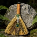 Macro detail of ritual broom featuring a bronze dragon pendant and natural peacock feather - Clear Quartz Viking Dragon Broom