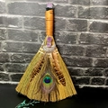 Detailed view of handmade altar broom with amethyst crystals and peacock feathers - Hollow Moon