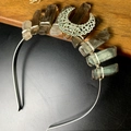 Macro view of handmade crystal crown with natural stones and antique bronze moon accessory - Smoky Quartz Hollow Moon Style