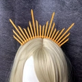 Macro detail of golden zip tie halo headband showing sunburst rays on a hair model - Sacred Halo Vision (款式12)
