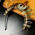 Macro view of handmade moon pendant and raw crystal stones on the silver bridal crown - Smoky Quartz Crown