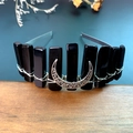 Detailed macro of handcrafted black obsidian moon headband with silver wire wrapping - Obsidian + Moon