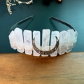Macro shot of handmade crystal moon crown with silver wire wrapping and crescent detail - White Crystal With Moon