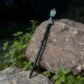 Crystal magic wand hair pin with Celtic knot and spiral wooden handle on a natural rock - Iridescent White