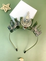 Detail of silver alloy tiara featuring green natural crystals and hollow moon ornaments - Moss Agate