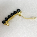 Detailed close-up of handmade gold wire hair comb featuring faceted black crystal beads - 4cm / Black Gold Clip